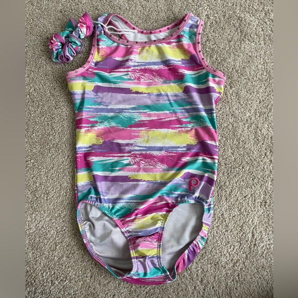 Gently used Plum Practicewear leotard in size child large with scrunchie